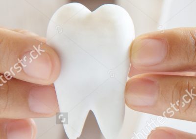 stock-photo-dentist-holding-molar-dental-concept-125939228